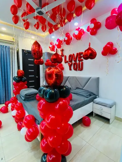This view shows the balloon pillars and ceiling decorations in the red and black romantic theme.