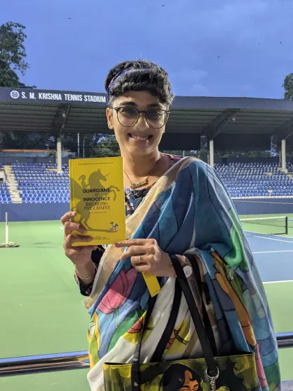 Holding a copy of "Guardians of Innocence" at the S.M. Krishna Tennis Stadium. I make it a point to promote the work of people in my network across different platforms.