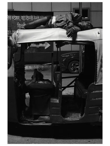 In the dead of night, a man finds rest atop his auto-rickshaw outside a Delhi railway station. It's a quiet, powerful image of resilience and a slice of life from my 24-hour documentary project.