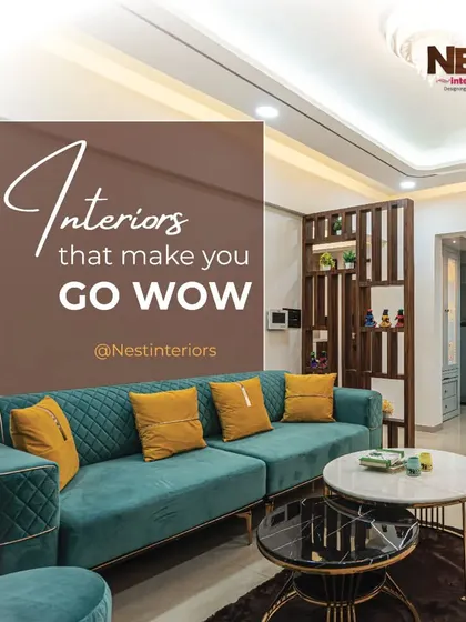 My goal is to create interiors that make you go "wow." This living room, with its bold teal sofa and modern furniture, is an example of that.