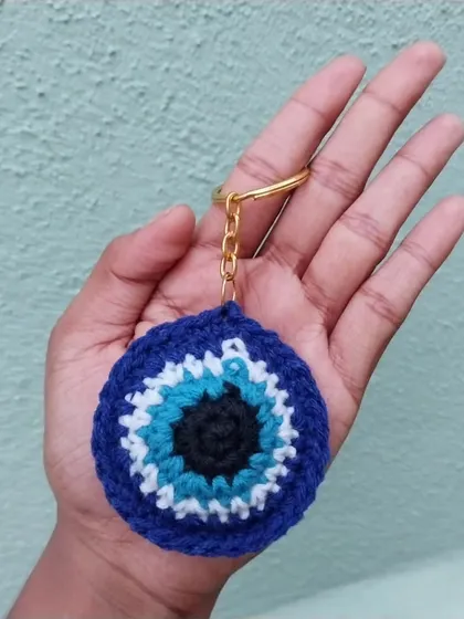 A simple, elegant version of the evil eye keychain without the tassel. This minimalist design is also available for custom and bulk orders.