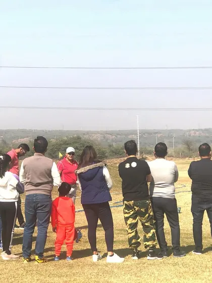 A view from behind the group at the Simi Mehra masterclass, showing players of all ages and genders eager to learn.