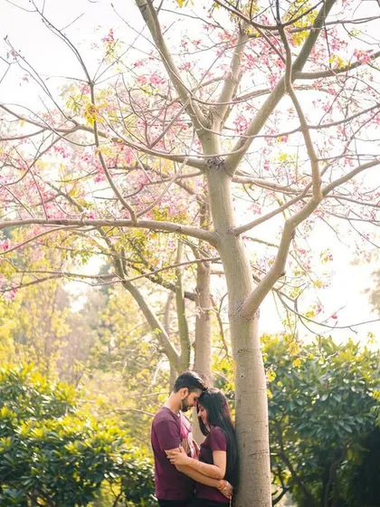 A quiet, romantic embrace under a blossoming tree. We seek out beautiful natural settings that provide a soft, romantic backdrop for your pre-wedding session.