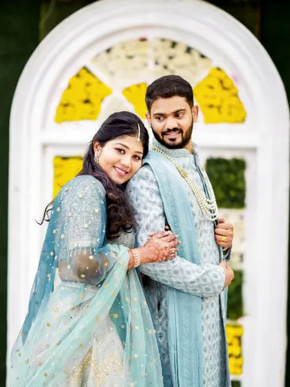 A sweet portrait from the same event, with the bride resting her head on the groom's shoulder.