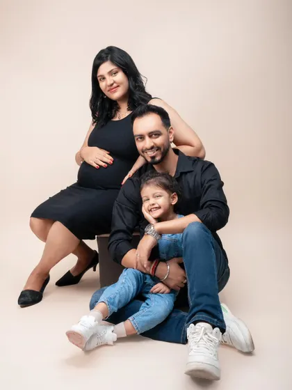 A picture perfect moment before a family of three becomes four. This portrait is all about capturing the love, laughter, and anticipation that fills a home when a new life is on the way.