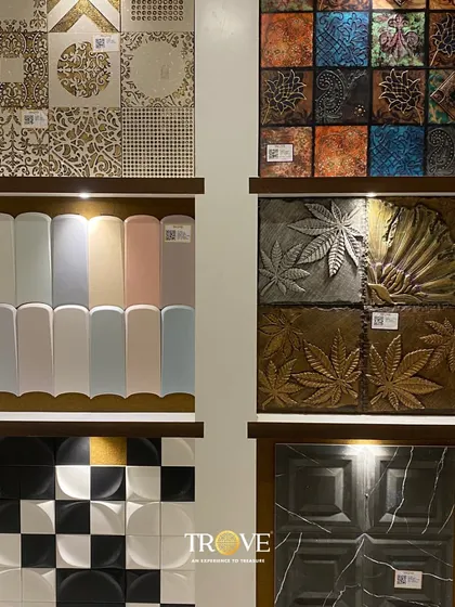 A close-up of some of my most unique designer tiles. This display features everything from checkerboard patterns and pastel-colored curved tiles to intricate metallic and nature-inspired relief tiles.
