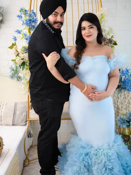 A lovely pose where the couple stands together, his arm gently guiding hers. It’s a portrait that speaks of partnership and support on this incredible journey.