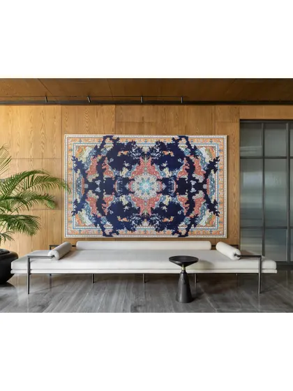 Opposite the console in the K Residence lobby is a long, minimalist bench from my Koko collection, placed beneath a Jason Seife artwork. This area serves as an extension for large gatherings, allowing guests to flow from the living room.