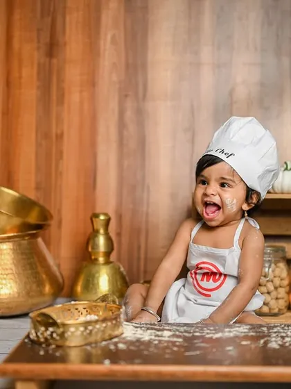 Let's get messy and have some fun! This 'Little Chef' theme is perfect for a first birthday or a fun toddler shoot. We use flour, little vegetables, and traditional kitchen props to create these adorable and playful pictures.