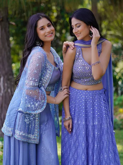 Two models sharing a lighthearted moment in complementary lavender outfits. This shot captures a genuine connection, making the fashion feel accessible and perfect for a lookbook aimed at friends or bridesmaids.