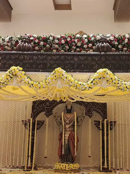 Another perspective of the grand Balaji mandap, showing the complete structure with its pillars and floral decorations before the ceremony.