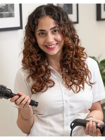 Our top stylist, Parteet, is ready to create your next look. Our team members are not just technicians; they are artists.