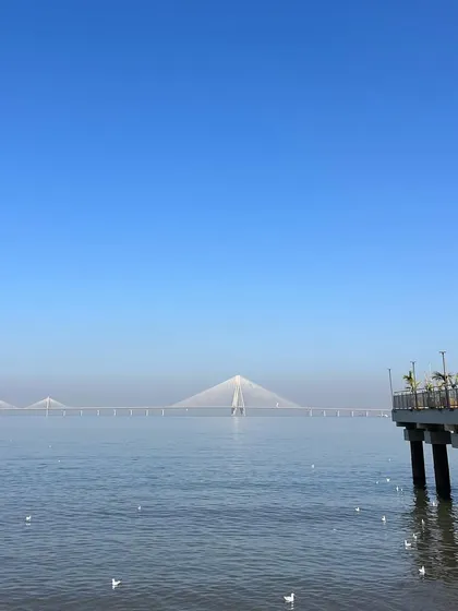 A serene view of the Bandra-Worli Sea Link from the Dadar viewing deck on a clear day.