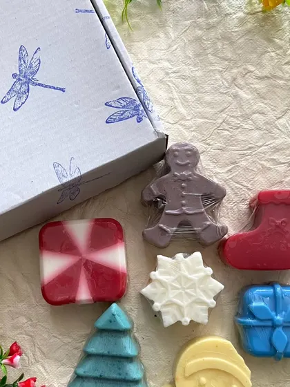 The Christmas soap collection next to one of my custom-stamped gift boxes. It's all about the little details.
