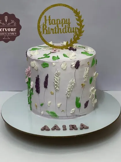 A hand-piped floral cake with a rustic, wildflower feel. This mixed fruit cake was delivered to a cafe for a special birthday celebration.