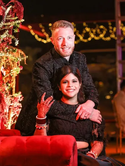 A grand reception under a canopy of red drapes and fairy lights. This setting for Sonam and Ross at Amitarasa was designed to feel both grand and intimate, a perfect space for conversations and making memories.