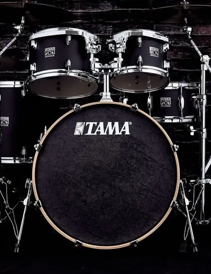 The full Tama Superstar Classic kit against a dark brick wall, emphasizing its powerful stage presence.