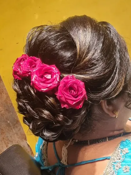 This messy bun updo is perfect for a wedding guest. I've used both pearl accessories and fresh roses to show how you can customize the look.