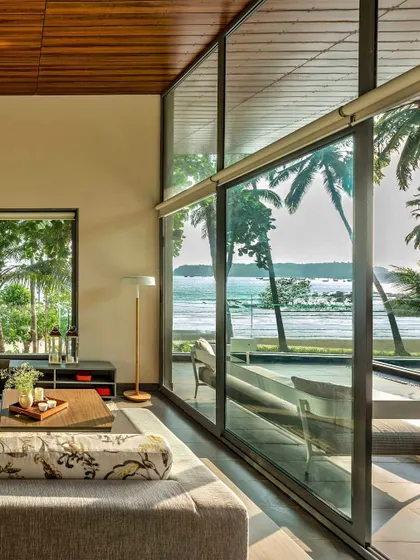 Another view of the beach-facing residence, where the design dissolves the boundary between the interior and the stunning natural surroundings.
