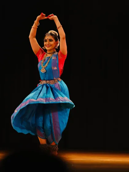 A joyful, swirling movement captured during a performance, expressing the sheer bliss of dance.