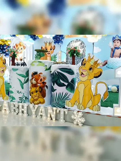 A closer look at the personalized details for Abhyant's Lion King party. We've included marquee letter's spelling out the name, character cutout's of Simba and Timon & Pumbaa, and a large light-up number '1'.