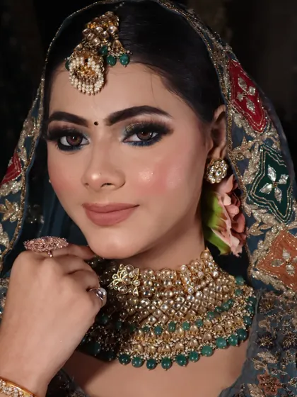 A close-up portrait that beautifully captures the detailed eye makeup and the flawless skin finish. This is the level of detail I teach in my advanced classes.