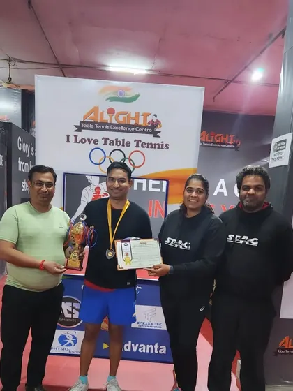 A participant receiving his award at the Alight Open Corporate Tournament. We make sure every winner is recognized for their achievement.
