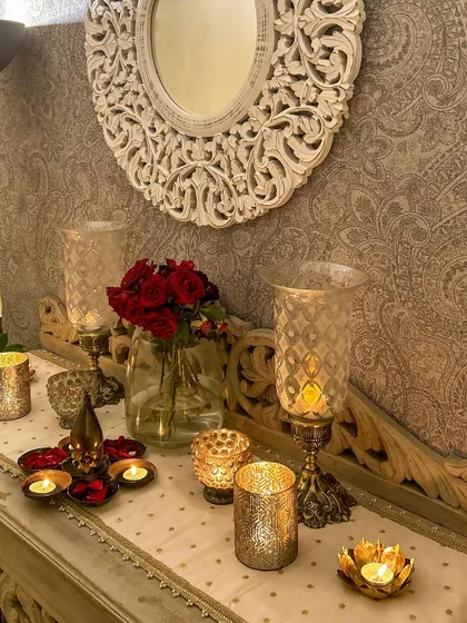 A close-up of the candle and flower arrangement on the console table. These small details make all the difference.