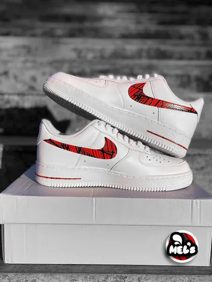 A full product shot of the MotoGP custom Nikes on their box.