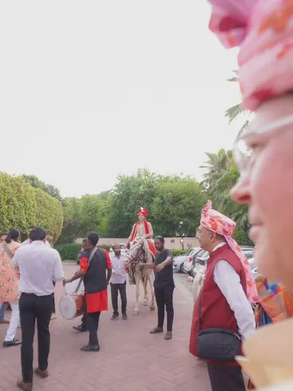 A guest's perspective of the groom's procession. This over-the-shoulder shot makes you feel like you are right there in the middle of the celebration.