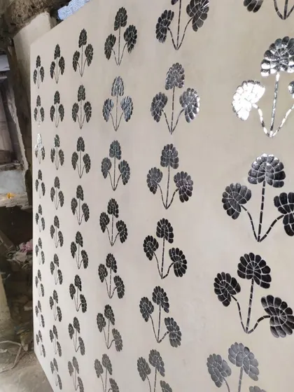 The finished Thikri panel, with hundreds of hand-cut pieces of convex glass set into plaster. This 400-year-old Rajasthani craft creates a stunning, reflective surface that plays with light.