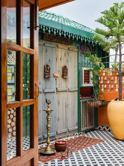 A view from inside, looking out onto the vibrant, art-deco inspired patio.