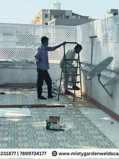 Our team at work installing the PVC lattice privacy screen on a terrace. We ensure every panel is perfectly aligned for a professional and secure finish.
