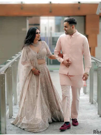 A candid shot of the newly engaged couple walking and sharing a laugh. Capturing these unposed, happy moments is key to telling the real story of your celebration.