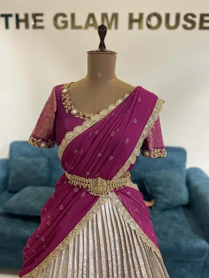 A custom-ordered half saree in a regal combination of silver and magenta, complete with a traditional waist belt (vaddanam).
