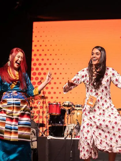 The spirit of 'Wassa Wassa' isn't just for our participants. Here are two of our performers, Dawa and Manisha, sharing a moment of pure joy and dance on stage.