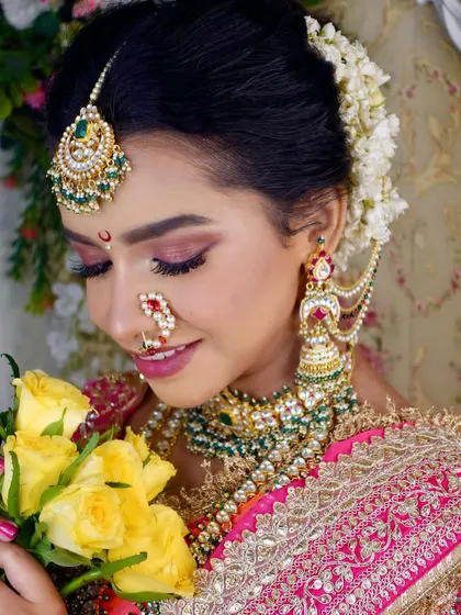 The complete Maharashtrian bridal look, featuring a beautiful blend of pink eyeshadow, a traditional nath, and elegant jewelry. My students learn to harmonize all these elements perfectly.