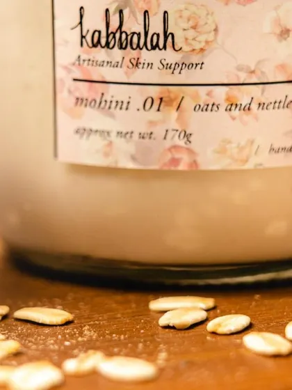 A close-up of my 'Mohini' oats and nettle body yogurt with its key ingredient. Oats are incredibly soothing for the skin, and I use them to create this deeply hydrating, vegan formula.