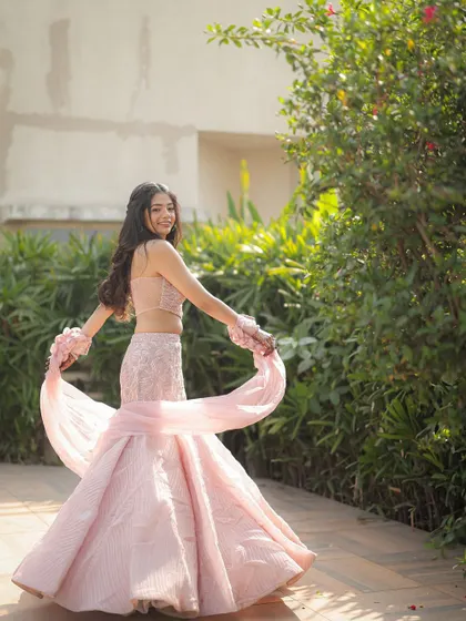 A playful, twirling shot of Sweta at her engagement. Her soft makeup and flowing hair look absolutely beautiful in the natural light.