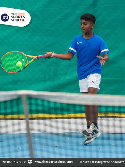 A young tennis player focuses on his forehand, preparing with the confidence that comes from dedicated preparation.