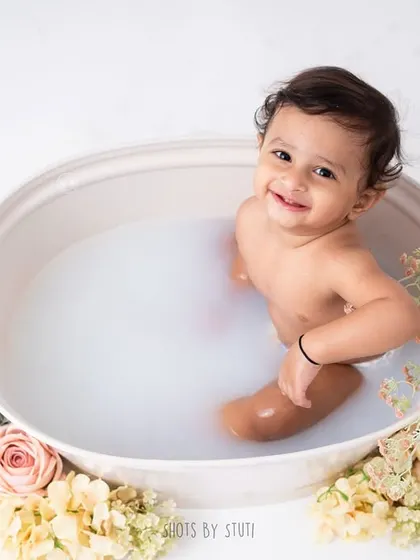 After the smash comes the splash! A warm bubble bath is the perfect way to clean up and get some more adorable photos. This little guy's happy smile shows just how much fun it is.