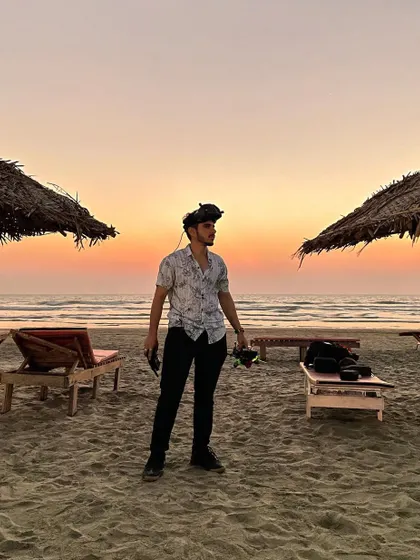 A photo from my three-year FPV journey, standing on a beach at sunset, a symbol of the beautiful places this craft has taken me.