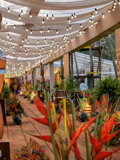 A duplicate of image 233, showing the detailed Tiki statues and floral arrangements along the walkway.