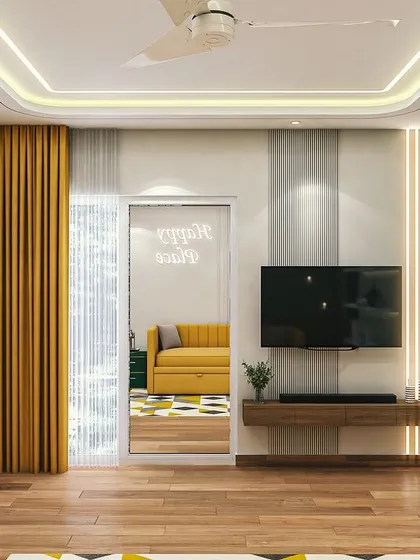 A view of the TV wall in the guest room, which continues the theme of green, white, and yellow. The open shelves provide space for books and decor.