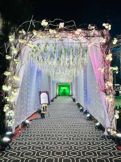 Another shot of the enchanting wisteria and branch entrance, showcasing the beautiful lighting effect.