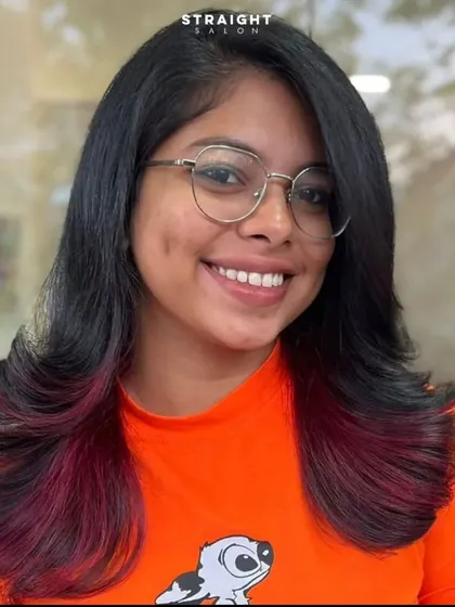 Embracing my colorful mane with these fun, peekaboo red tips on a layered cut.