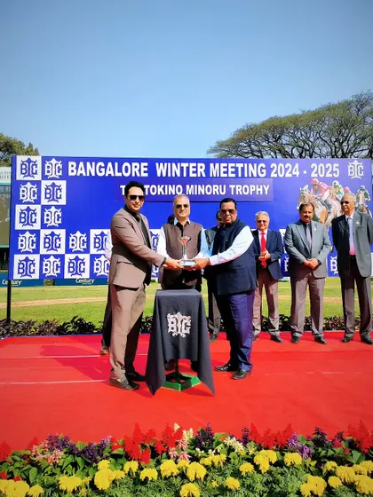 Mr. C. Mahesh Medappa presents The Tokino Minoru Trophy to the winning connections.