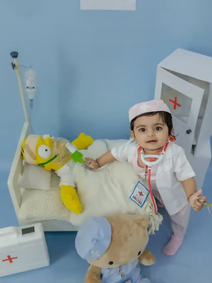 Dr. Happy making her rounds, checking on her patient in this adorable themed setup.