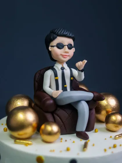 A close-up of the handcrafted "Boss" figurine, showing the detail in his expression and attire.