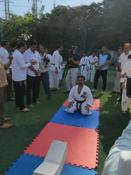 Preparing mentally just moments before the cement block record attempt. In this moment, all that exists is the mat, the blocks, and the goal.